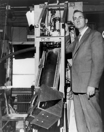 Photo: Dr. Charles H. Townes, co-inventor of the laser, stands with a ruby maser amplifier, a device that paved the way for laser technology, in a 1957 photo. Photo Credit: Cortesy Alcatel-Lucent Bell Labs