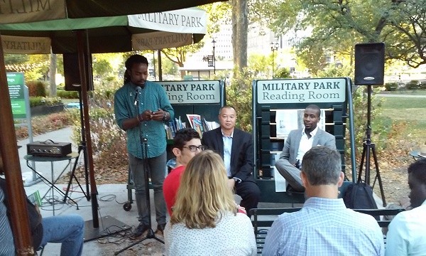 Photo: L-R: Isaiah Little, standing, with Kevin Chu and Chike Uzoka seated at the Military Park tech talk Sept. 12. Photo Credit: Givon Zirkind