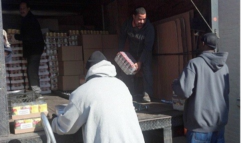 Photo: Volunteers unload a truck full of goods delivered to a Meeting Emergency Needs with Dignity (MEND) pantry in N.J.The pantries are low on food after Sandy, and some are still without power, but the demand for their services has increased. Photo Credit: YouGiveGoods