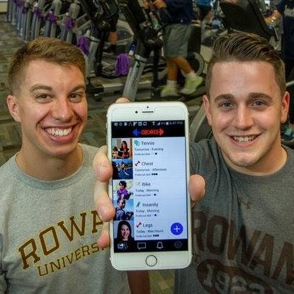 Photo: The fitDEGREE team, Nick Dennis (L) with Dan Read (R) shows off its phone app. Photo Credit: Courtesy fitDegree